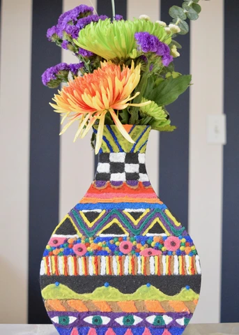 Make a gorgeous boho chic vase with colored sand!  Get this fun sand project tutorial on ACTIVA's website.